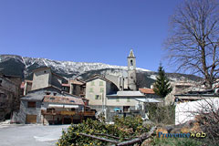 Méailles, village, bell tower and snowy mountains