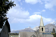 Le Vernet, bell tower and snowy mountains