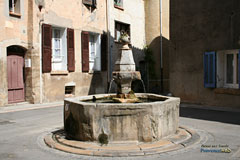 Besse sur Issole, arched passage and Romanesque fountain