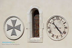 Saint Roman de Malegarde, clock on the pediment of the church